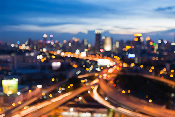istock Abstract blurred lights city and road 636443756