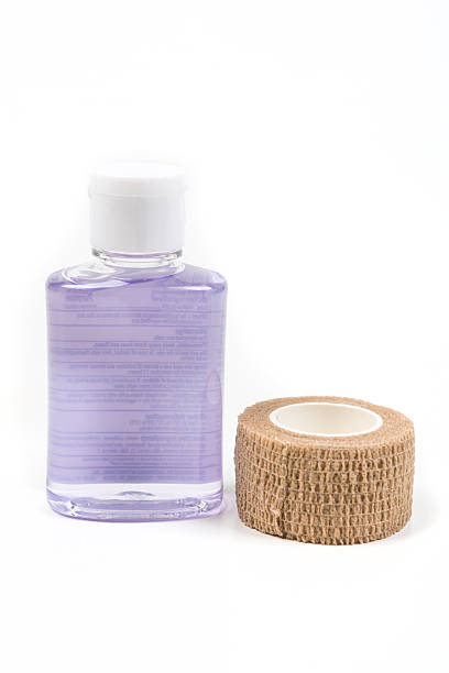 istock Small container of hand sanitizer and bandage 636446210
