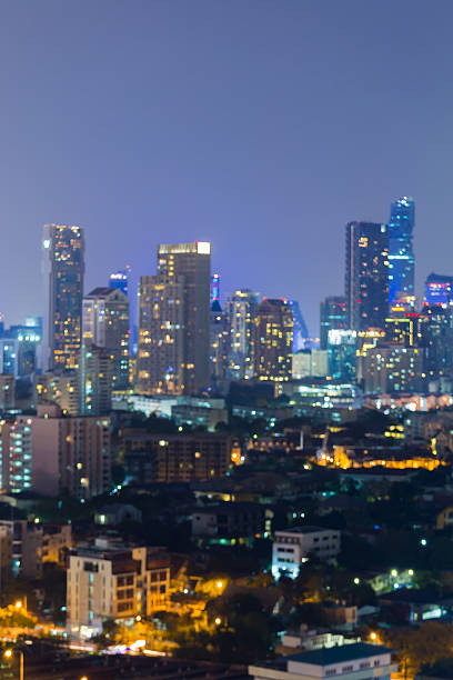 istock Twilight city office building lights blurred bokeh 636446236