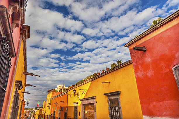 Yellow Orange Town Street San Miguel de Allende Mexico Yellow Orange Street Blue Sky San Miguel de Allende Mexico. san miguel de cozumel stock pictures, royalty-free photos & images