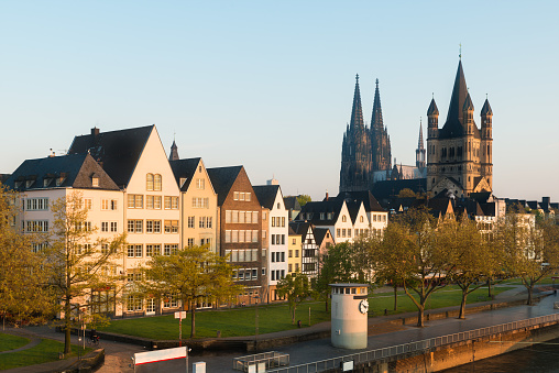 Many of Cologne colorful Houses and park at dusk in Cologne, Germany.