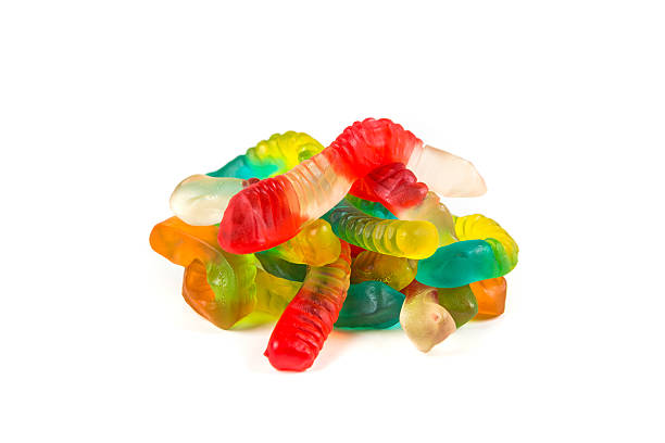 istock Multicolored gummy worms isolated on a white background 636447446