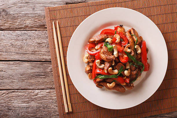 istock chicken pieces fried with vegetables and cashew nuts closeup 636447792