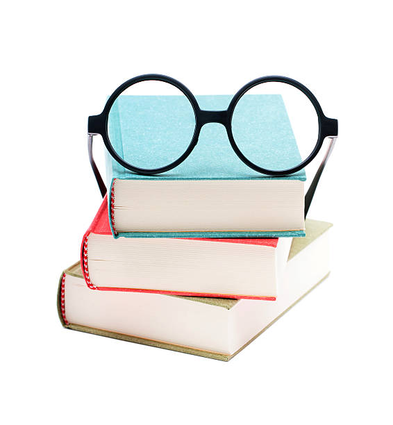 istock Books and glasses isolated on white background 636447912