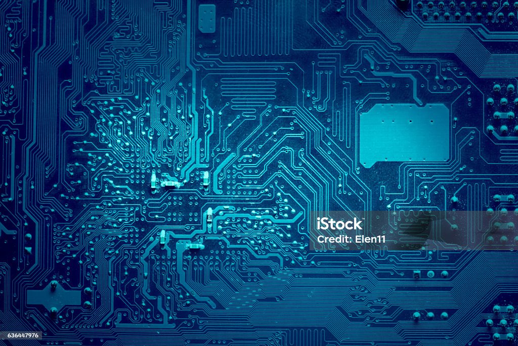 Computer electronic circuit. Blue color, faded at the sides. Circuit Board Stock Photo