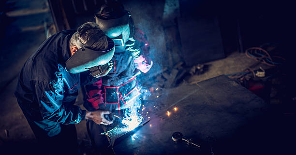 istock Team of welders 636448762