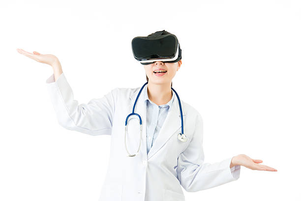 istock asian doctor hand measure by VR headset glasses device 636449326