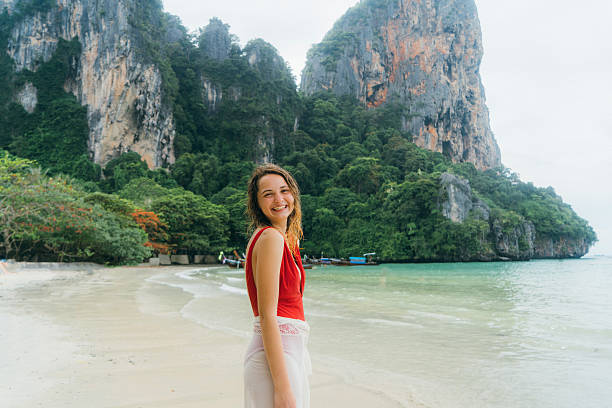 istock Woman on beach in Thailand 636450440