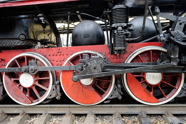 istock Red wheels of vintage steam engine on railway 636452268