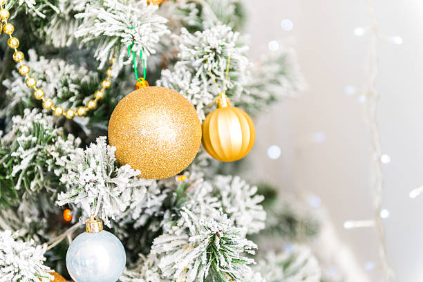 istock Christmas tree background, bright gold ornaments new year, white fireplace 636455776