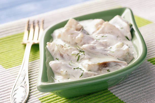 Herring in sour cream sauce with dill. stock photo