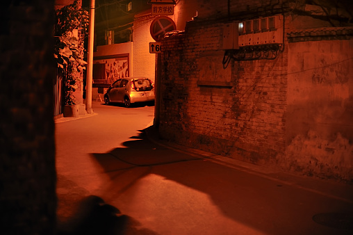 Beijing, China - July 9, 2015: shichahai The deep alley of the night, in a corner, the alley (hutong) under a street lamp illuminates.