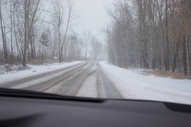 istock foggy winter road 636461110