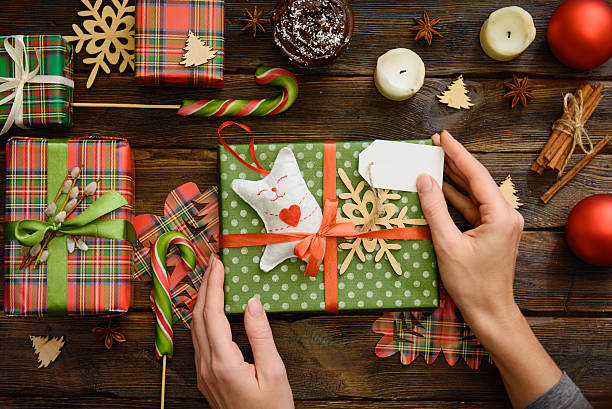 istock Give present box, decoration of gift on wooden table 636461358