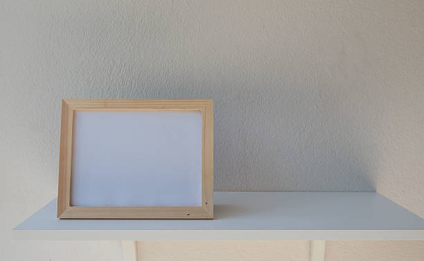 istock photo Frame on a wooden on White background 636462142