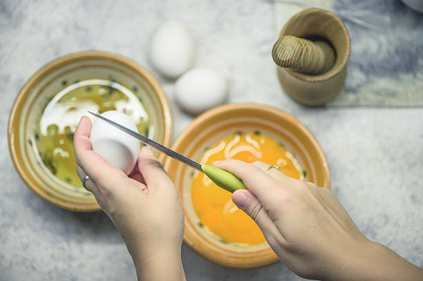 istock Egg white and egg yolk in two bowls. 636462672