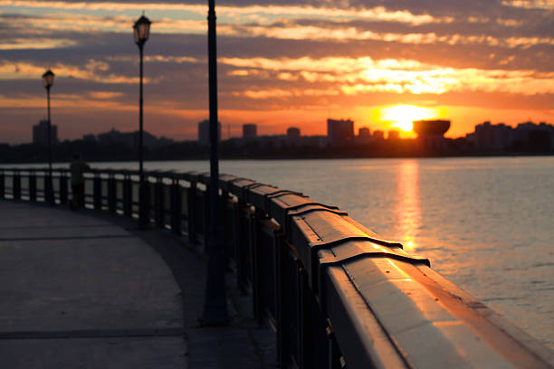 istock seafront fence sunrise 636462720
