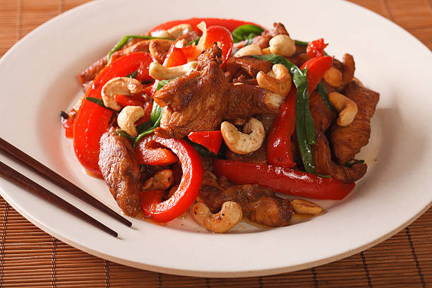istock Thai chicken with vegetables and cashew close-up. Horizontal 636463960