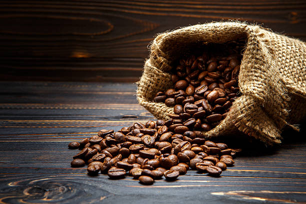 istock roasted coffee beans on wooden background 636464330
