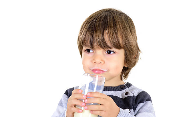 istock Little boy is drinking milk 636464598