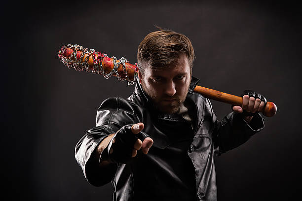 istock Killer with bloody bat on black background. 636466368