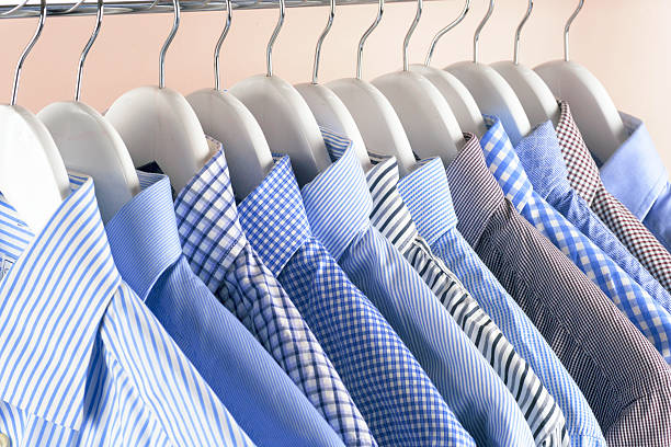 istock Cloth Hangers with Shirts. Men's clothes 636469306