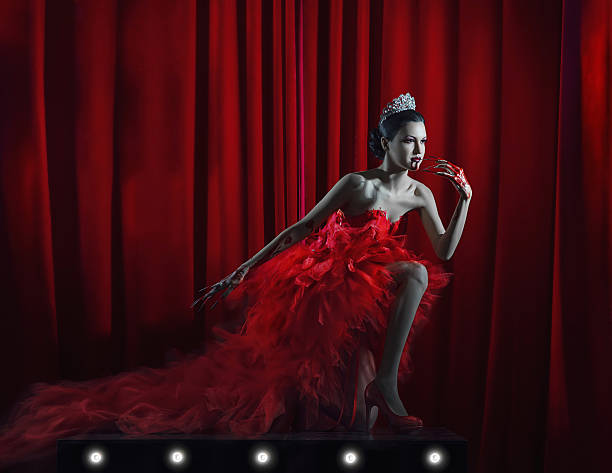 istock glamour vamp girl on the throne 636472728