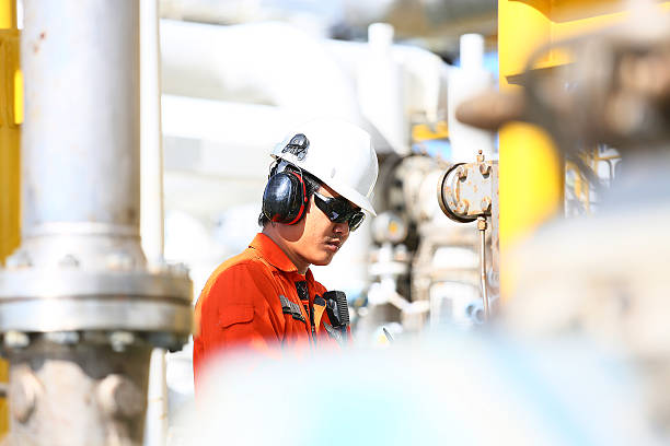 istock operator recording operation of oil and gas process 636472822