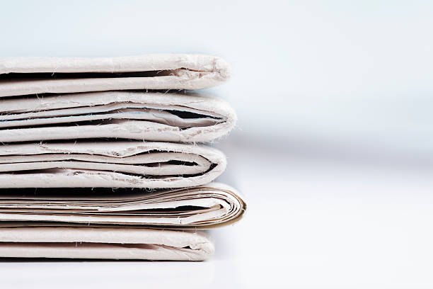 istock Stack of newspaper extreme close up with copy space 636476416
