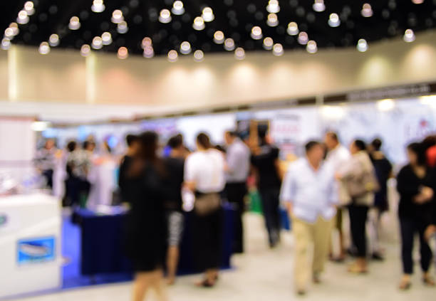 istock blurred image abstract people walking in shopping centre. 636477654