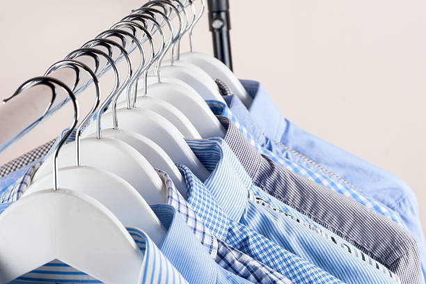 istock Cloth Hangers with Shirts. Men's clothes 636478428