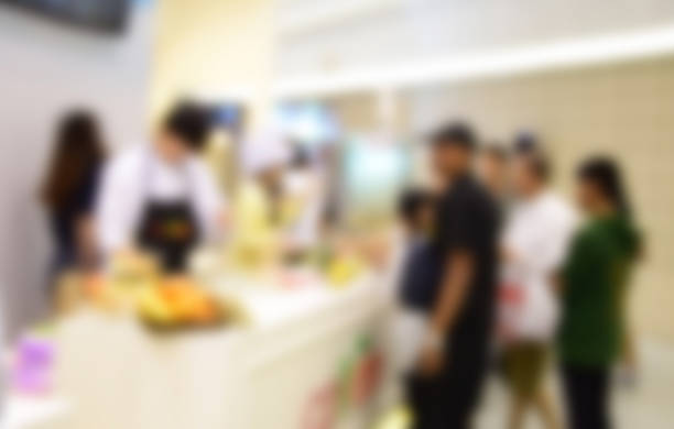 istock blurred image people in food center with light bokeh. 636479916
