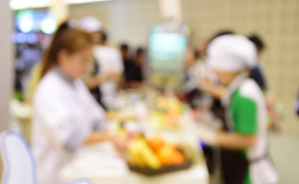 istock blurred image people in food center with light bokeh. 636480030