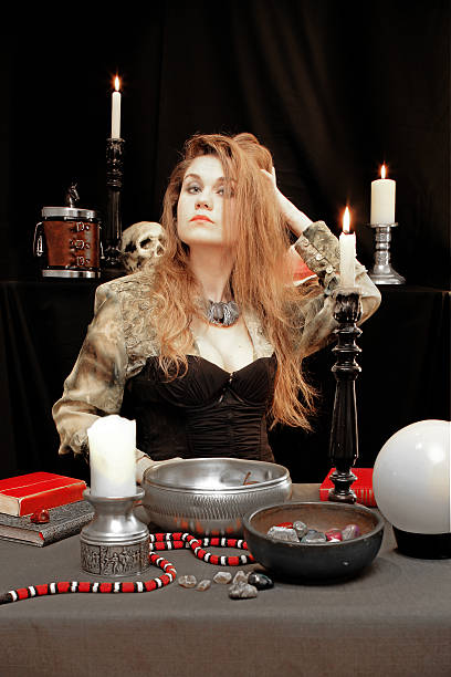 istock Sexy witch fluffing her hair 636481568