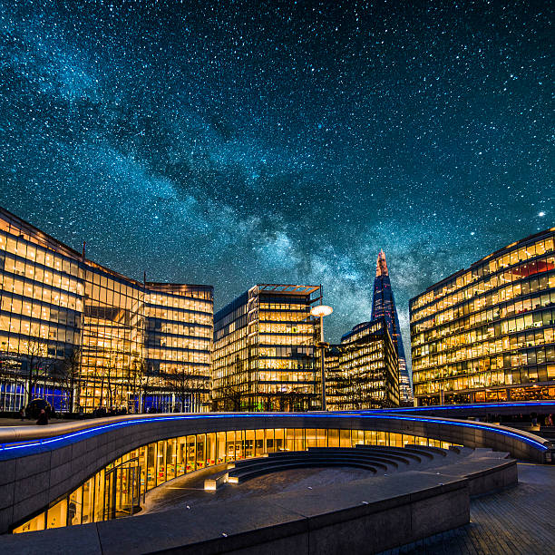 Blocks of offices at night in London, England, under the Milky Way. 