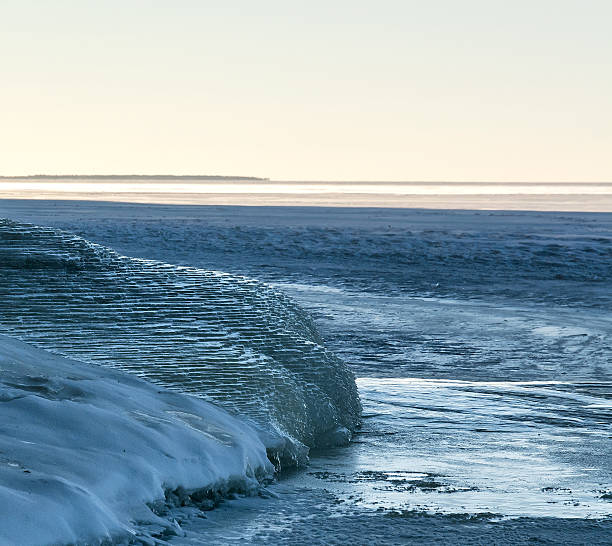 istock Water dribbles down ice formations on Lake Superior shorline. 636486616