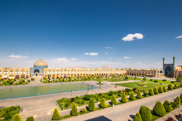Naqsh-e Jahan or Imam Square, Isfahan, Iran Naqsh-e Jahan Square, known also as Imam Square and formerly known as Shah Square, is a square situated at the center of Isfahan city, Iran. Constructed between 1598 and 1629, it is now an important historical site, and one of UNESCO's World Heritage Sites. It is 160 metres (520 ft) wide by 560 metres (1,840 ft) long (an area of 89,600 square metres (964,000 sq ft)). On the left part famous Lotfollah Mosque is visible, on the right end the Shah Mosque (also known as Imam Mosque and Jaame' Abbasi Mosque) could be seen. isfahan stock pictures, royalty-free photos & images