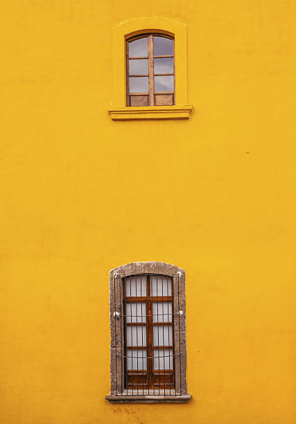 istock Bright Yellow Wall Windows San Miguel de Allende Mexico 636495238