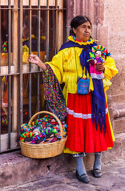 Indian Woman Peddler Souvenirs Jardin San Miguel de Allende Mexico San Miguel de Allende, Mexico - December 27, 2014: Indian Woman Peddler Souvenires Lupita Dolls Jardin Town Square San Miguel de Allende Mexico. san miguel de cozumel stock pictures, royalty-free photos & images