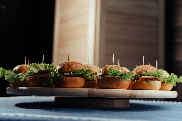 istock Hamburger on wood table. Home made burger. Fastfood meal. 636498708