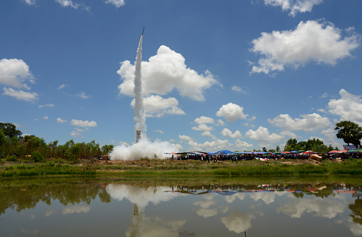 a rocket start at the traditonal rocket festival or Bun Bang Fai  in Ban Si Than in the Provinz Amnat Charoen in the northwest of Ubon Ratchathani in the Region of Isan in Northeast Thailand in Thailand.