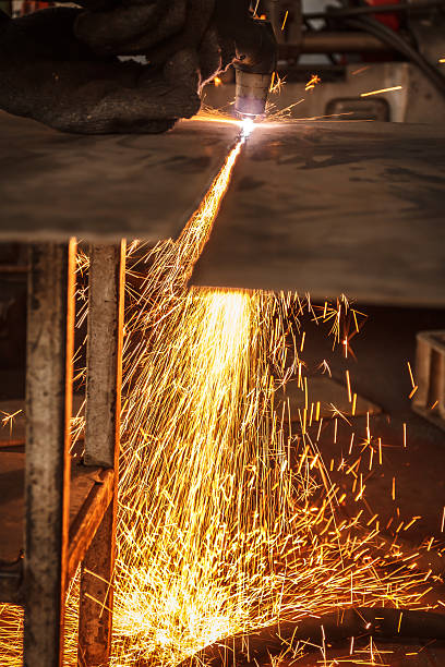 istock Sparks while cutting steel in the factory 636502014