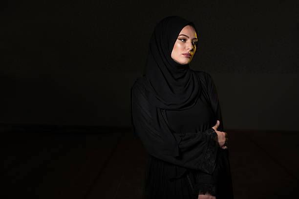 istock Attractive Muslim Woman On Black Background 636504756