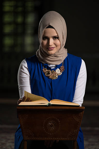 istock Muslim Woman Is Reading The Koran 636504862