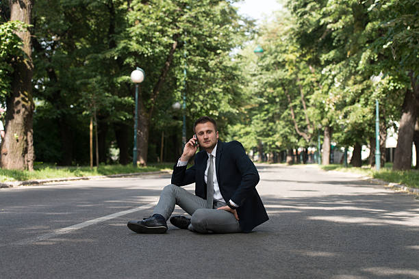 istock Businessman Talking On Telephone Outdoors In Park 636508136