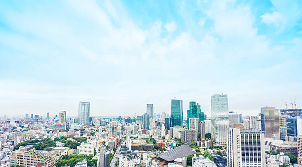Panoramic modern city aerial view in Tokyo, Japan Business and culture concept - panoramic modern city skyline bird eye aerial view from tokyo tower under dramatic sunny and morning blue cloudy sky in Tokyo, Japan kanto region photos stock pictures, royalty-free photos & images