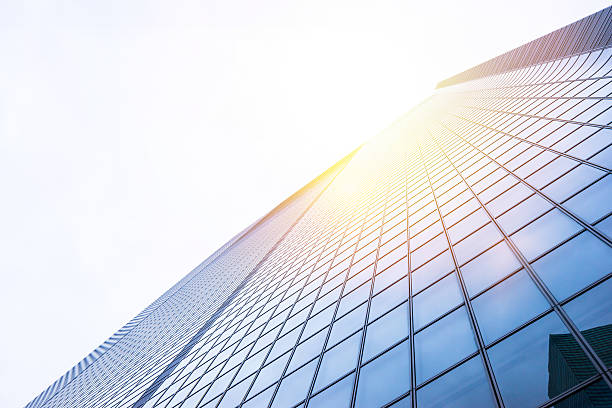 istock Looking up view in financial building 636508502