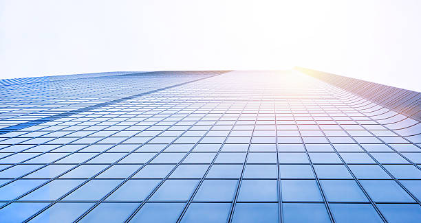 istock Looking up view in financial building 636508526