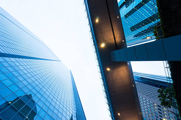 istock Looking up view in financial building 636508596
