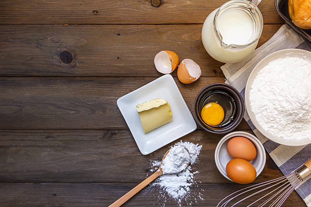 istock baking background with raw eggs, butter and flour 636510684